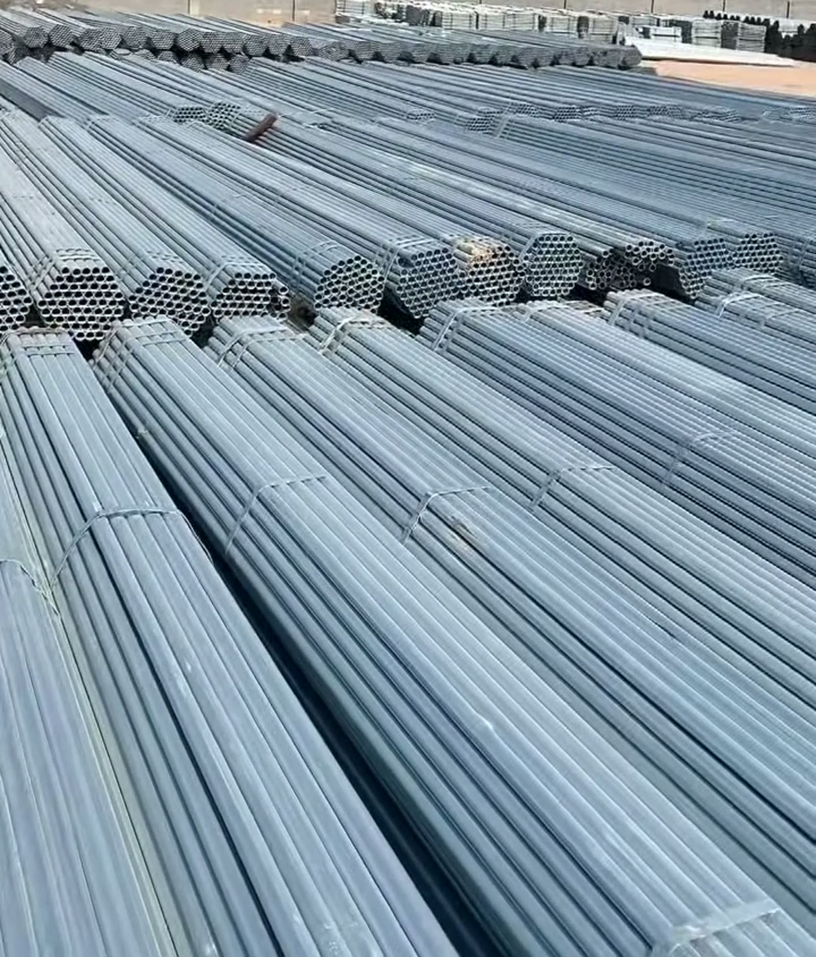 Threaded galvanized pipes stacked in the yard
